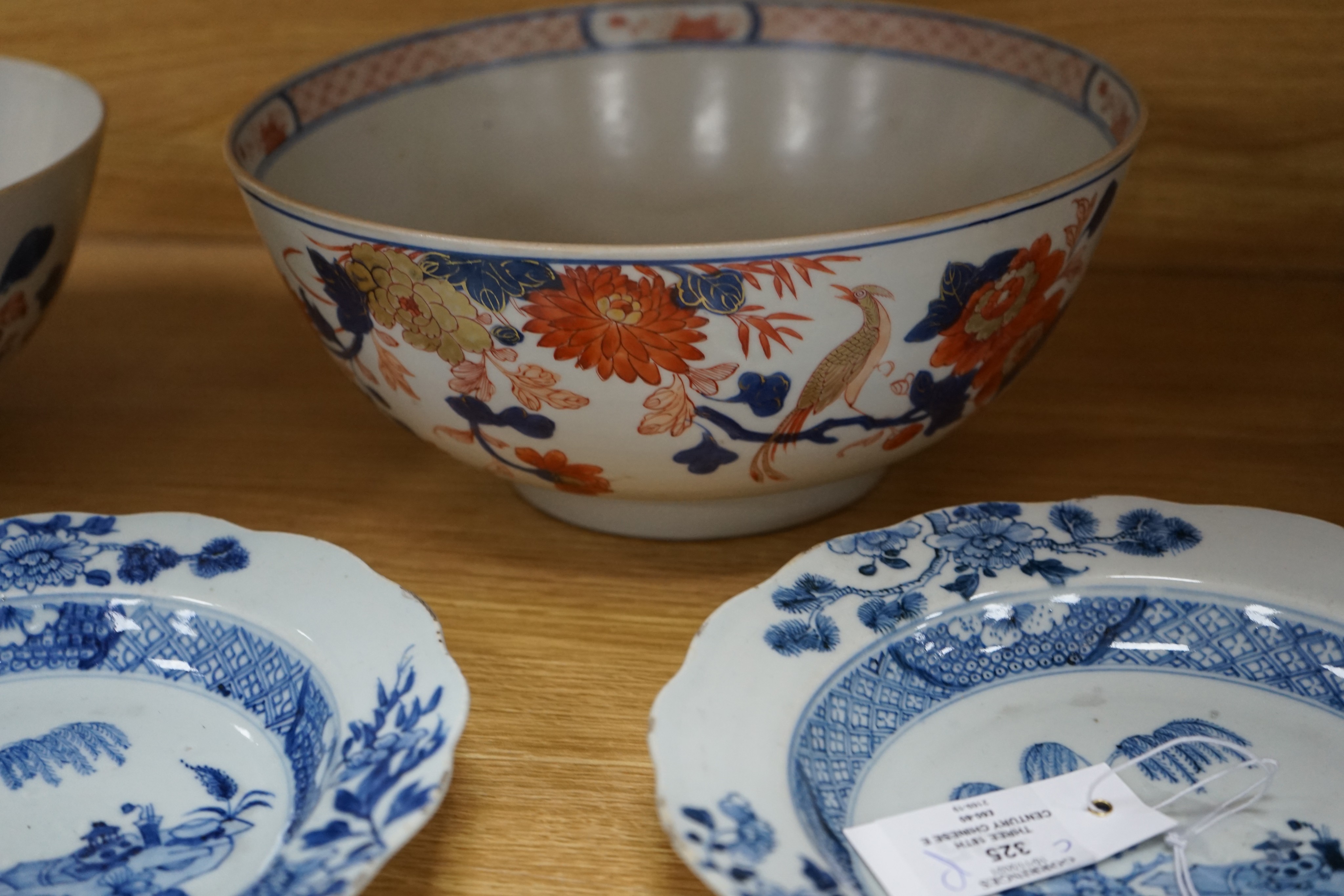 Three 18th century Chinese export porcelain bowls, largest 28 cm and two plates